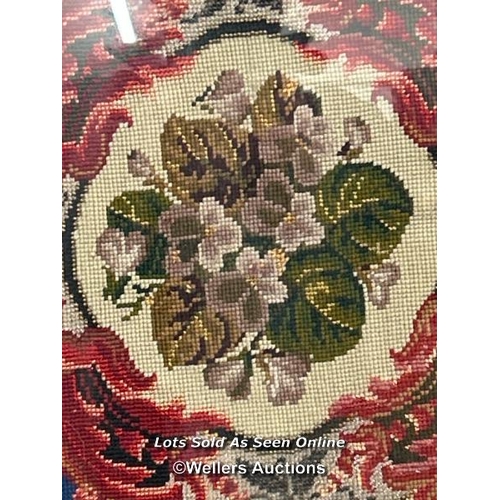 281 - An oval floral tapestry in wooden frame (damaged), 54x63cm