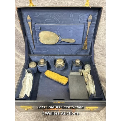 309 - A travelling dressing table set (incomplete) comprising of hand mirror hallmarked 1928, silver shoe ... 