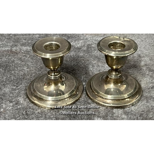 310 - Quantity of silver : A pair of short candlesticks, hallmarked Birmingham 1907, a crystal jam pot wit... 