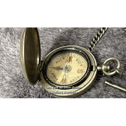 312 - A floating compass with hallmarked silver chain and silver hallmarked button hook / T42