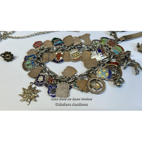 333 - Silver charm bracelet with thirty-eight mostly souvenir charms, along with a silver chain and assort... 