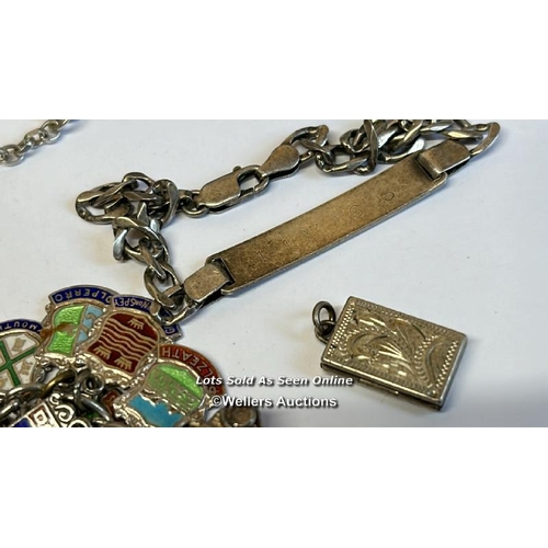 333 - Silver charm bracelet with thirty-eight mostly souvenir charms, along with a silver chain and assort... 