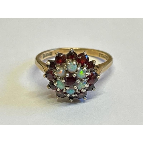 364 - Opal and garnet cluster ring stamped 9ct gold. Ring size M, gross weight 3.89g / SF