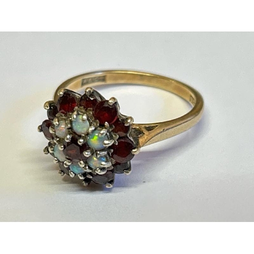 364 - Opal and garnet cluster ring stamped 9ct gold. Ring size M, gross weight 3.89g / SF