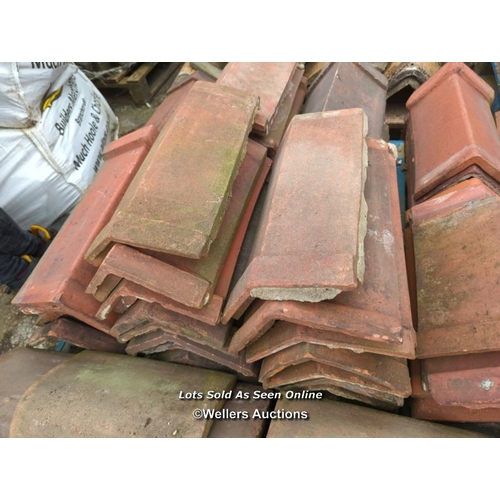 1025 - APPROX X50 ANGLED RED RIDGE TILES, LONGEST 49CM