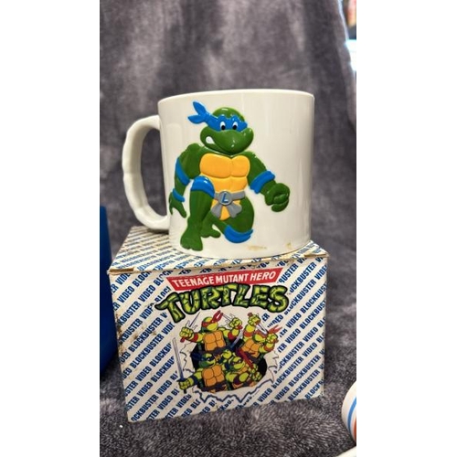 15 - 1980's - 1990's Teenage Mutant Hero Turtles items including lunchbox, Blockbuster Video mug, torch a... 