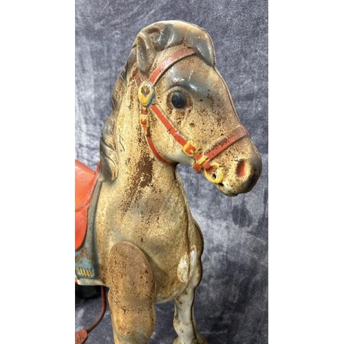 60 - A vintage 1940's - 1950's Mobo tinplate pedal horse on casters, in need of restoration, movement app... 