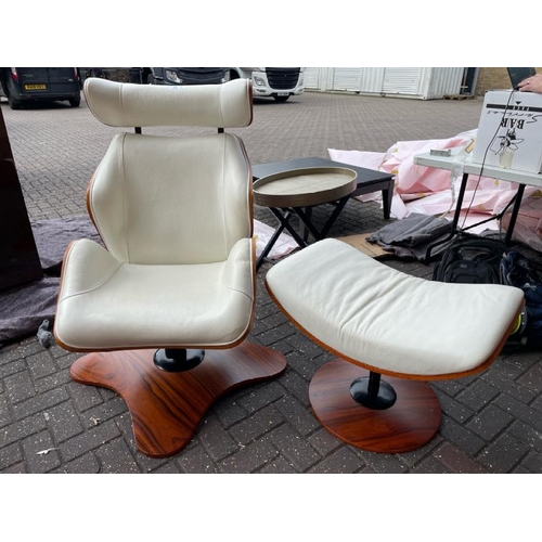 32 - CREAM FAUX LEATHER AND WOOD SWIVEL CHAIR WITH MATCHING FOOT STOOL, CHAIR 112CM HIGH X 66.5CM WIDE X ... 