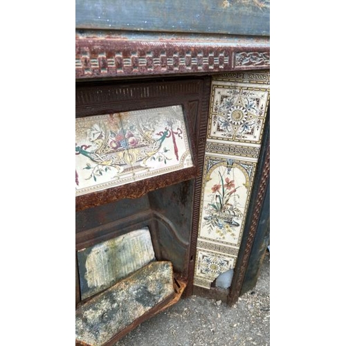 1225 - A CAST IRON FIRE SURROUND AND INSERT, WITH DECORATIVE TILE INLAY, SOME DAMAGED, 98CM (H) X 96CM (W) ... 