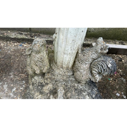 1253 - A RECONSTITUTED STONE STATUE OF A CHERUB PLAYING THE BLOWPIPES, SURROUNDED BY FAUNA, 85CM (H) / ALL ... 