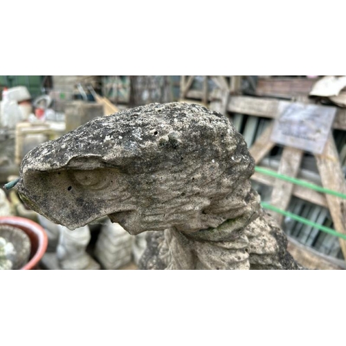 1335 - AN OLD RECONSTITUTED STONE STATUE OF A FALCON, MISSING WINGS AND IS SHOWING SIGNS OF A HISTORICAL RE... 