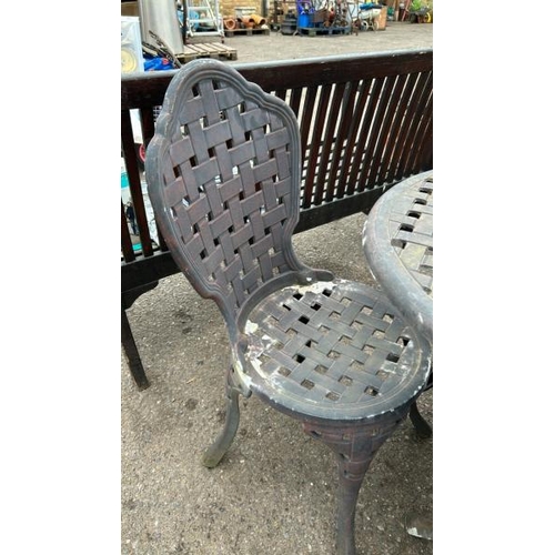 1379 - A METAL GARDEN TABLE AND FOUR CHAIRS / ALL LOTS ARE LOCATED IN SL0 9LG, REGRETFULLY WE DO NOT OFFER ... 