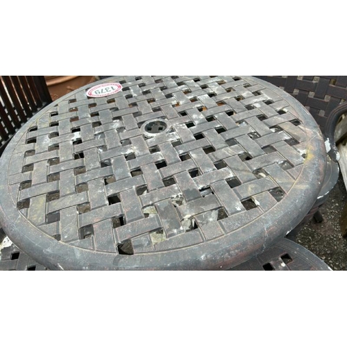 1379 - A METAL GARDEN TABLE AND FOUR CHAIRS / ALL LOTS ARE LOCATED IN SL0 9LG, REGRETFULLY WE DO NOT OFFER ... 