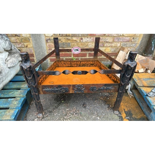 1396 - AN OLD CAST IRON LOG STORE WITH EGYPTIAN FEATURES, 66CM (H) X 85CM (W) X 50CM (D) / ALL LOTS ARE LOC... 