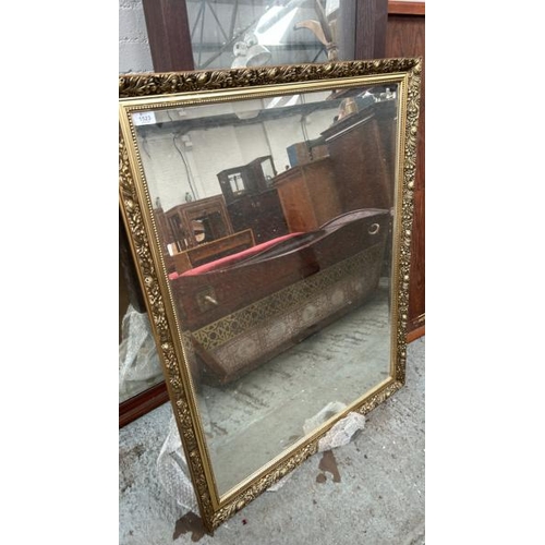 1523 - A LARGE BEVELLED EDGE MIRROR IN ORNATE FRAME, 86 X 112CM / ALL LOTS ARE LOCATED IN SL0 9LG, REGRETFU... 