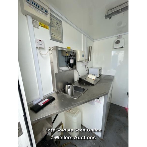 1004 - 6 PERSON 12 X 7.5FT AJC EASY CABIN TOWABLE WELFARE UNIT, INCLUDES WASH BASIN, KETTLE, MICROWAVE, SEA... 