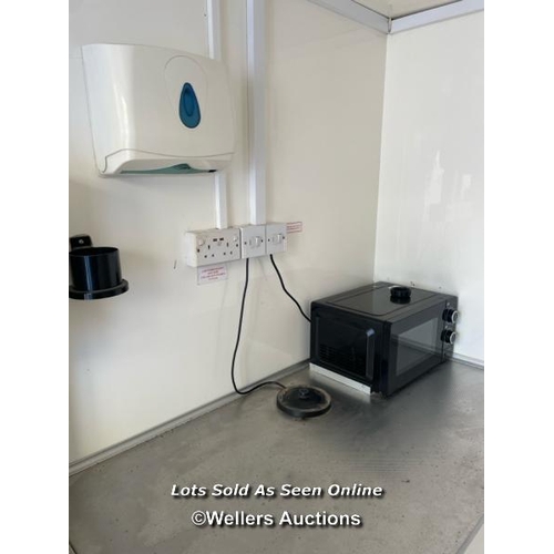 1007 - 6 PERSON 12 X 7.5FT AJC EASY CABIN TOWABLE WELFARE UNIT, INCLUDES WASH BASIN, KETTLE, MICROWAVE, SEA... 