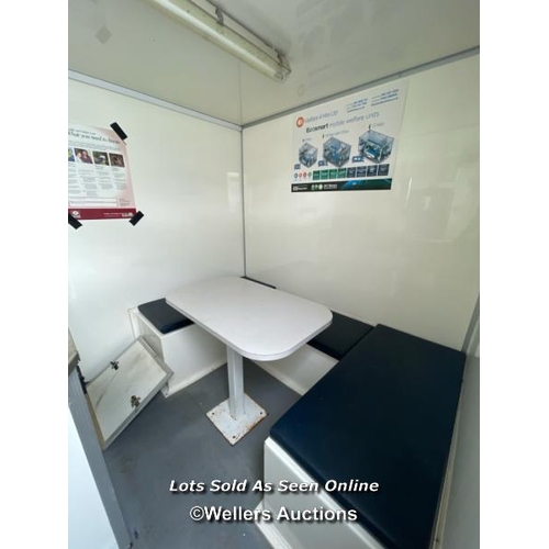 1010 - 6 PERSON 12 X 7.5FT AJC EASY CABIN TOWABLE WELFARE UNIT, INCLUDES WASH BASIN, KETTLE, MICROWAVE, SEA... 