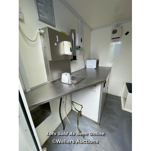 1015 - 6 PERSON 12 X 7.5FT AJC EASY CABIN TOWABLE WELFARE UNIT, INCLUDES WASH BASIN, KETTLE, MICROWAVE, SEA... 