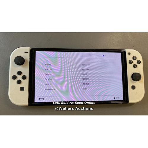 9591 - NINTENDO SWITCH OLED / HEG-001 / SN: XTJ10907495113 / RESTORED TO FACTORY DEFAULTS