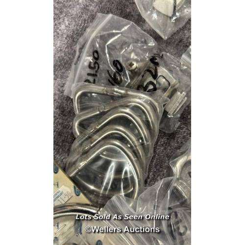 912 - SMALL BAG OF MAINLY STAINLESS STEEL MARINE SUNDRIES INCLUDING ROPE RINGS