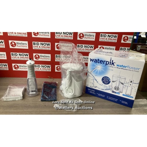 4011 - WATERPIK WATER FLOSSER / PART USED CONDITION / SOME ITEMS SEALED / MISSING ONE POWER SUPPLY / SEE IM... 