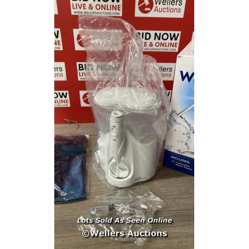 4011 - WATERPIK WATER FLOSSER / PART USED CONDITION / SOME ITEMS SEALED / MISSING ONE POWER SUPPLY / SEE IM... 