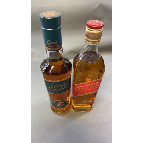 9528 - X1 NEW GRAND CAVALIER BRANDY 38% VOL. 50CL AND X1 NEW JOHNNIE WALKER RED LABEL WHISKY 40% VOL. 70CL