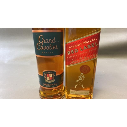 9528 - X1 NEW GRAND CAVALIER BRANDY 38% VOL. 50CL AND X1 NEW JOHNNIE WALKER RED LABEL WHISKY 40% VOL. 70CL