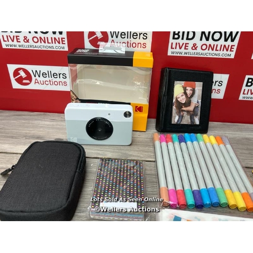 8494 - KODAK PRINTOMATIC INSTANT CAMERA (PINK) GIFT BUNDLE + ZINK PAPER (20 SHEETS) + CASE + 7 STICKER SETS... 