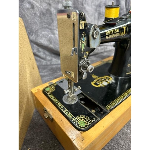 36 - A BRITISH HARRODIA SEWING MACHINE NO. 501869, WITH ACCESSORIES AND HAND WRITTEN INSTRUCTIONS / T10