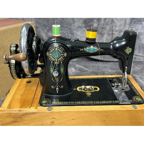 36 - A BRITISH HARRODIA SEWING MACHINE NO. 501869, WITH ACCESSORIES AND HAND WRITTEN INSTRUCTIONS / T10