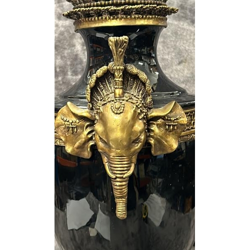 42 - A LARGE BLACK PORCELAIN AND BRASS URN WITH ELEPHANT HANDLES, BY JOHN RICHARD, IN GOOD CONDITION, 55C... 