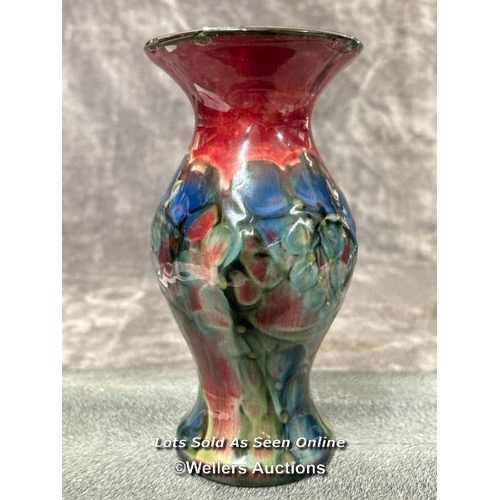 71 - A small glazed vase in the style of Moorcroft, 18.5cm high / AN11