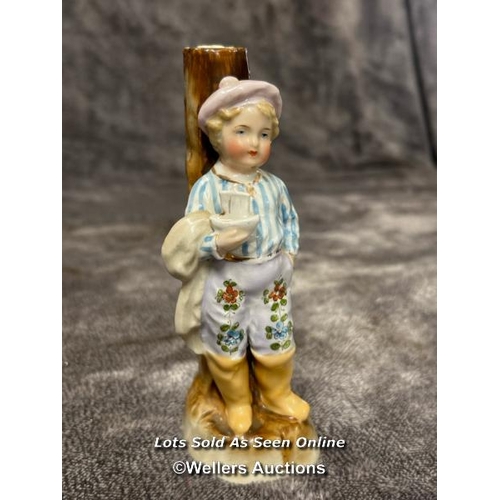 74 - A German Conta and Bohme figurine of a boy leaning against a tree with a chinese vase and a Barber s... 