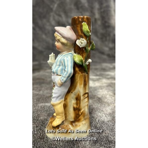 74 - A German Conta and Bohme figurine of a boy leaning against a tree with a chinese vase and a Barber s... 