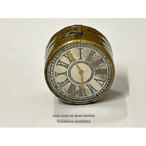 76 - Two very small brass compasses, both 1.5cm diameter. One has Chinese numerals with a printed clock o... 