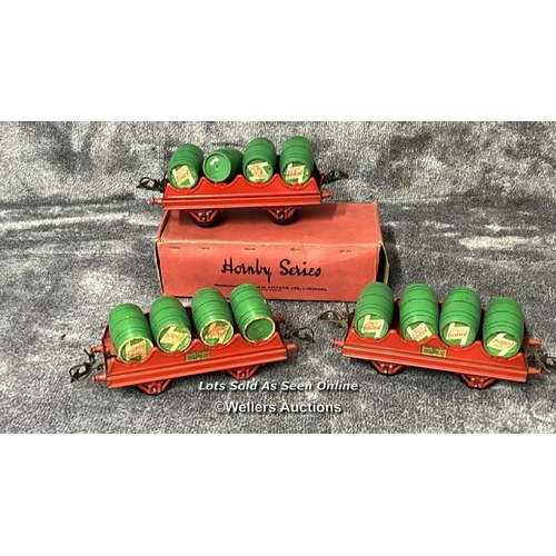 105 - Three Hornby 0 gauge barrel wagons no. RS691 each with four wooden Castrol Oil barrels, one boxed / ... 