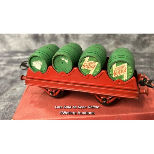 105 - Three Hornby 0 gauge barrel wagons no. RS691 each with four wooden Castrol Oil barrels, one boxed / ... 