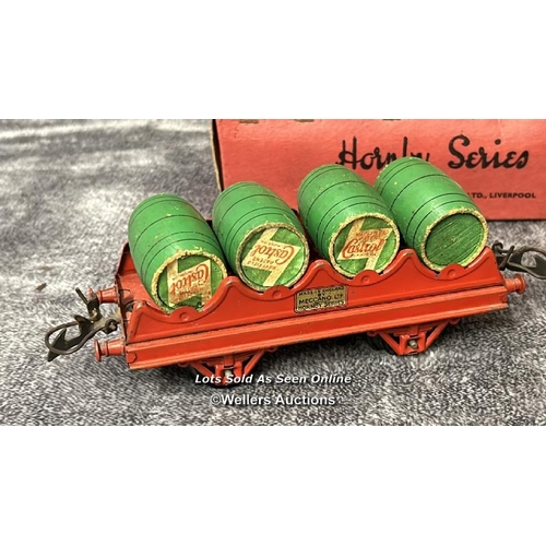 105 - Three Hornby 0 gauge barrel wagons no. RS691 each with four wooden Castrol Oil barrels, one boxed / ... 