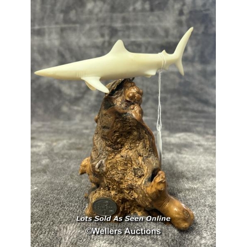 100 - A ceramic Shark figurine on wooden base by John Perry, 17cm high / AN17