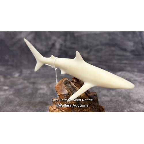 100 - A ceramic Shark figurine on wooden base by John Perry, 17cm high / AN17