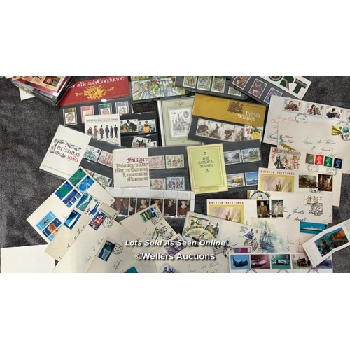 103 - A large collection of sealed British 1st day covers (approx 94) with stamped envelopes and postcards... 