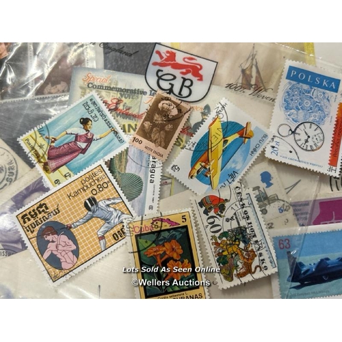 103 - A large collection of sealed British 1st day covers (approx 94) with stamped envelopes and postcards... 