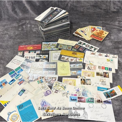 103 - A large collection of sealed British 1st day covers (approx 94) with stamped envelopes and postcards... 