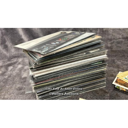 103 - A large collection of sealed British 1st day covers (approx 94) with stamped envelopes and postcards... 