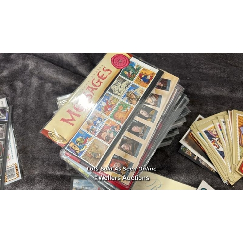 103 - A large collection of sealed British 1st day covers (approx 94) with stamped envelopes and postcards... 