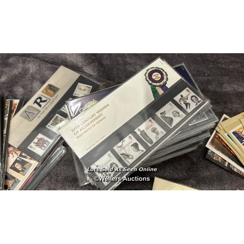 103 - A large collection of sealed British 1st day covers (approx 94) with stamped envelopes and postcards... 