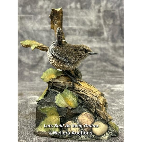 97 - A collection of four Arden Sculptures by Christopher Holt, including Wren on Apple, Wren, Bluetit an... 