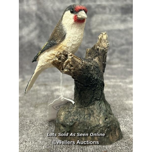 97 - A collection of four Arden Sculptures by Christopher Holt, including Wren on Apple, Wren, Bluetit an... 